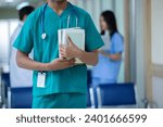 Portrait of medical student arms crossed holding learning book have group students on background in classroom hospital medical school. concept of medical and education.