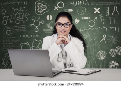 Portrait Of Medical Student With Curly Hair Looking At The Camera, Shot In The Class