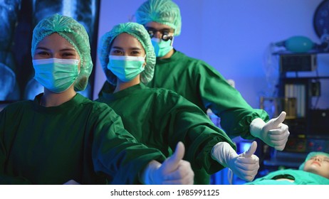 Portrait Of Medical Team Standing In Modern Hospital Building Professional Doctors And Assistants In Masks Celebrating Salary Increase Business Success At Workspace Meeting Conference.