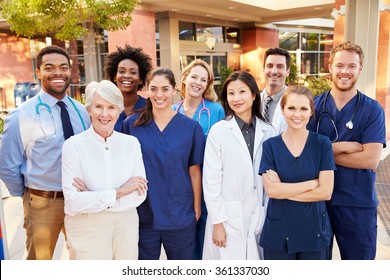 Portrait Of Medical Team Standing Outside Hospital