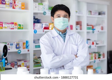 Portrait Of Men Pharmacist Asian Standing Hug And Protective Face Mask In Drugstore Thailand 
