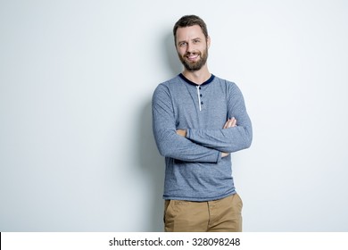 A Portrait of a men in studio gray background - Shutterstock ID 328098248