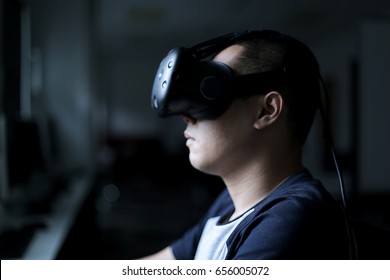Portrait of men wearing virtual reality HTC Vive headset