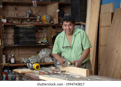 Portrait of a Mexican carpenter on his workshop