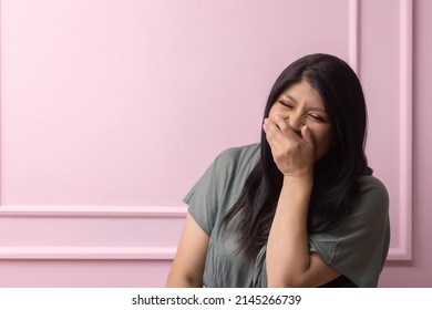 Portrait Of A Mexican Empowered Woman Isolated On Pink Background