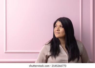 Portrait Of A Mexican Empowered Woman Isolated On Pink Background