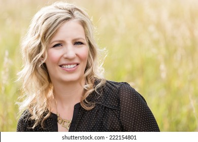 Portrait Of Middle Age Caucasian Female In Autumn.