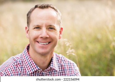 Portrait Of Middle Age Caucasian Male In Autumn.