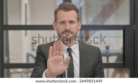 Portrait of Middle Aged Businessman with Stop Gesture