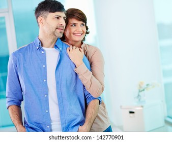 Portrait Of Middle Aged Couple Looking Forward