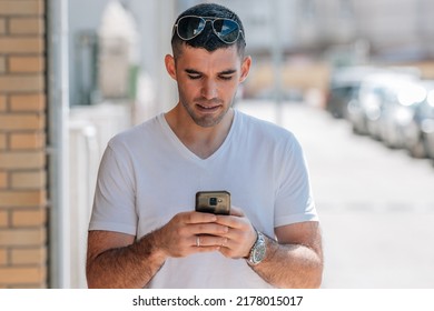 Portrait Of Middle Aged Man Looking At Mobile Phone