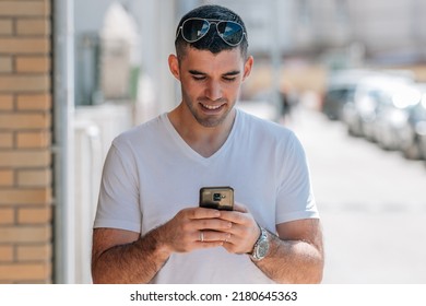 Portrait Of Middle Aged Man Looking At Mobile Phone