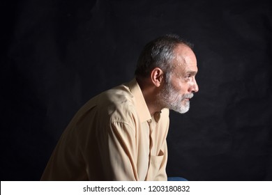 Portrait Of Middle Aged Man On Black