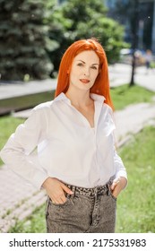 Portrait Of Middle Aged Woman With Dyed Red Hair