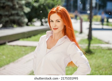 Portrait Of Middle Aged Woman With Dyed Red Hair