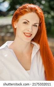 Portrait Of Middle Aged Woman With Dyed Red Hair