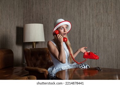 Portrait Middle Aged Woman Talking On Red Fixed Land Line Telephone In Vintage Interior Living Room. Female In Pin-up Style Dress In Polka Dot And Hat. Concept Retro Fashion And Trend. Copy Text Space