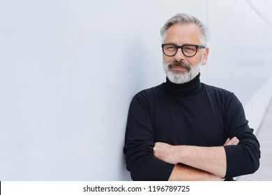 Portrait Of Middle-aged Bearded Man Wearing Black Polo Neck Jumper