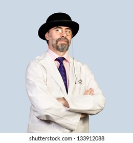 Portrait Of Middle-aged  Retro Doctor  In A Hat .on A Pale Background