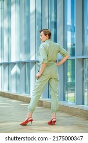 Portrait Of A Middle-aged Woman In A Green Jumpsuit