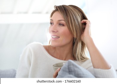 Portrait Of Middle-aged Woman Relaxing At Home