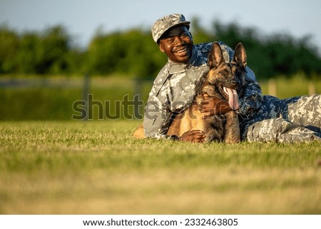 Portrait of military dog and soldier. True friendship and trust.
