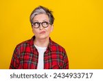 Portrait of minded pensive person look empty space contemplate ponder isolated on yellow color background