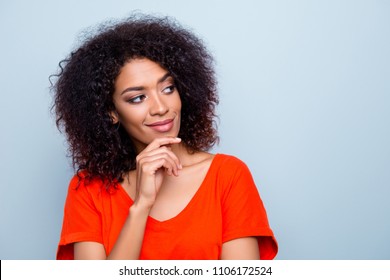 Portrait Of Minded Ponder Woman In Bright Outfit Holding Hand On Chin Looking At Copy-space With Smirk Isolated On Grey Background