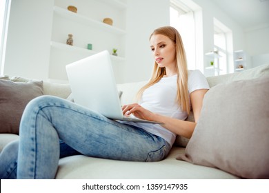 Portrait of minded serious charming collage student use user program gadget job clever intelligent feel dream dreamy sit sofa wear denim t-shirt search news in cozy comfort room - Shutterstock ID 1359147935