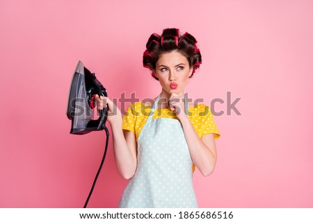 Portrait of minded wife hold iron touch finger chin look copyspace think isolated pastel color background
