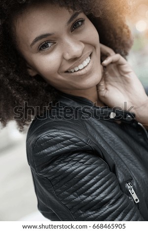 Similar – blYoung black woman, afro hairstyle, smiling outdoors