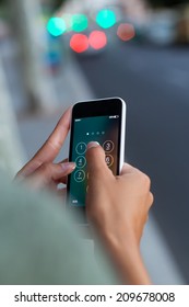 Portrait Of Mobile Phone In A Woman's Hand In The City At Night.