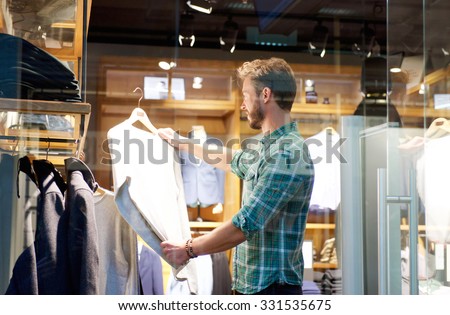 Portrait of a modern man shopping at mens store