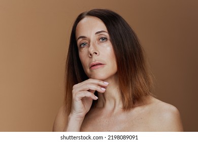 Portrait Of Modern Woman With Short Hair On Beige Background.