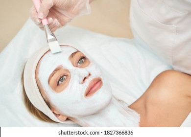 Portrait of moisturizing mask on white background for medical design. Woman skin procedure. Natural cosmetic products. Beauty face. Facial cosmetology treatment. Healthcare peeling cream - Powered by Shutterstock