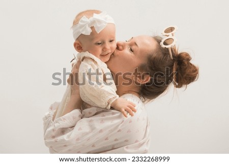 portrait of mom with daughter 1 year old isolated on white background.happy mom with daughter together