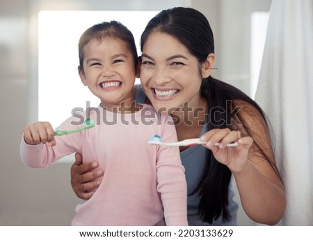 Portrait of mom and kid brushing teeth, dental healthy and cleaning in bathroom at home. Happy mother and girl learning oral healthcare, wellness and fresh breath for toothbrush, toothpaste and smile Foto stock © 