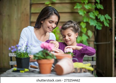 Portrait Of A Mother Daughter Special Moment. Gardening Discovering And Teaching