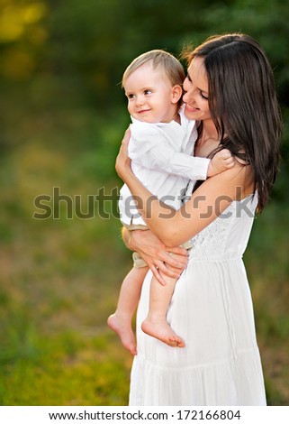 Similar – Eine weiße Frau mit einem schwarzen Baby.