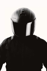 Portrait Of A Motorcycle Rider Posing With A Black Helmet On A White Background.