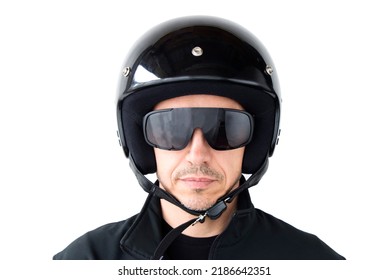 Portrait of a motorcyclist in a protective black helmet on an isolated white background. Safe ride concept.