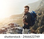 Portrait, mountains and hiking with man, smile and journey with nature, sunshine and getaway trip. Hobby, person and hiker with backpack, adventure and environment with happiness, holiday and fitness