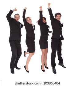 Portrait Of Multi Ethnic Team Of Business People Rejoicing Success On White Background