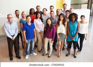 Portrait Of Multi-Cultural Office Staff Standing In Lobby - Shutterstock ID 174539315