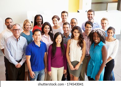 Portrait Of Multi-Cultural Office Staff Standing In Lobby