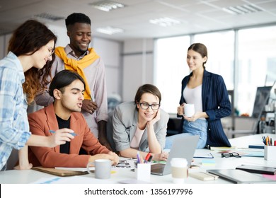 Portrait of multi-ethnic business team collaborating on project in modern office, copy space - Powered by Shutterstock