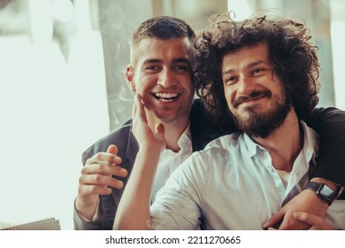 Portrait Of Multiethnic Diverse Gay LGBT Romantic Male Couple Embracing And Showing Their Love