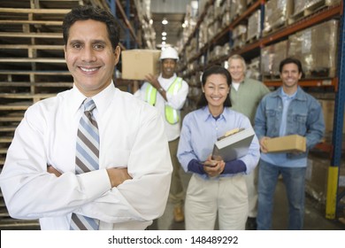 Portrait of multiethnic workers in distribution warehouse