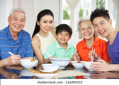 Portrait Of Multi-Generation Chinese Family Eating Meal Together