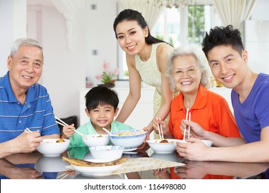 Portrait Of Multi-Generation Chinese Family Eating Meal Together